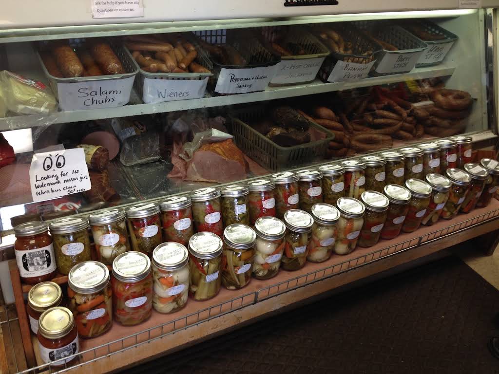 The Commissary deli counter with meats, sausages and pickled jars