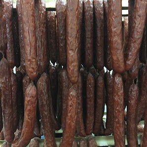 Rows of smoked sausages at The Commissary